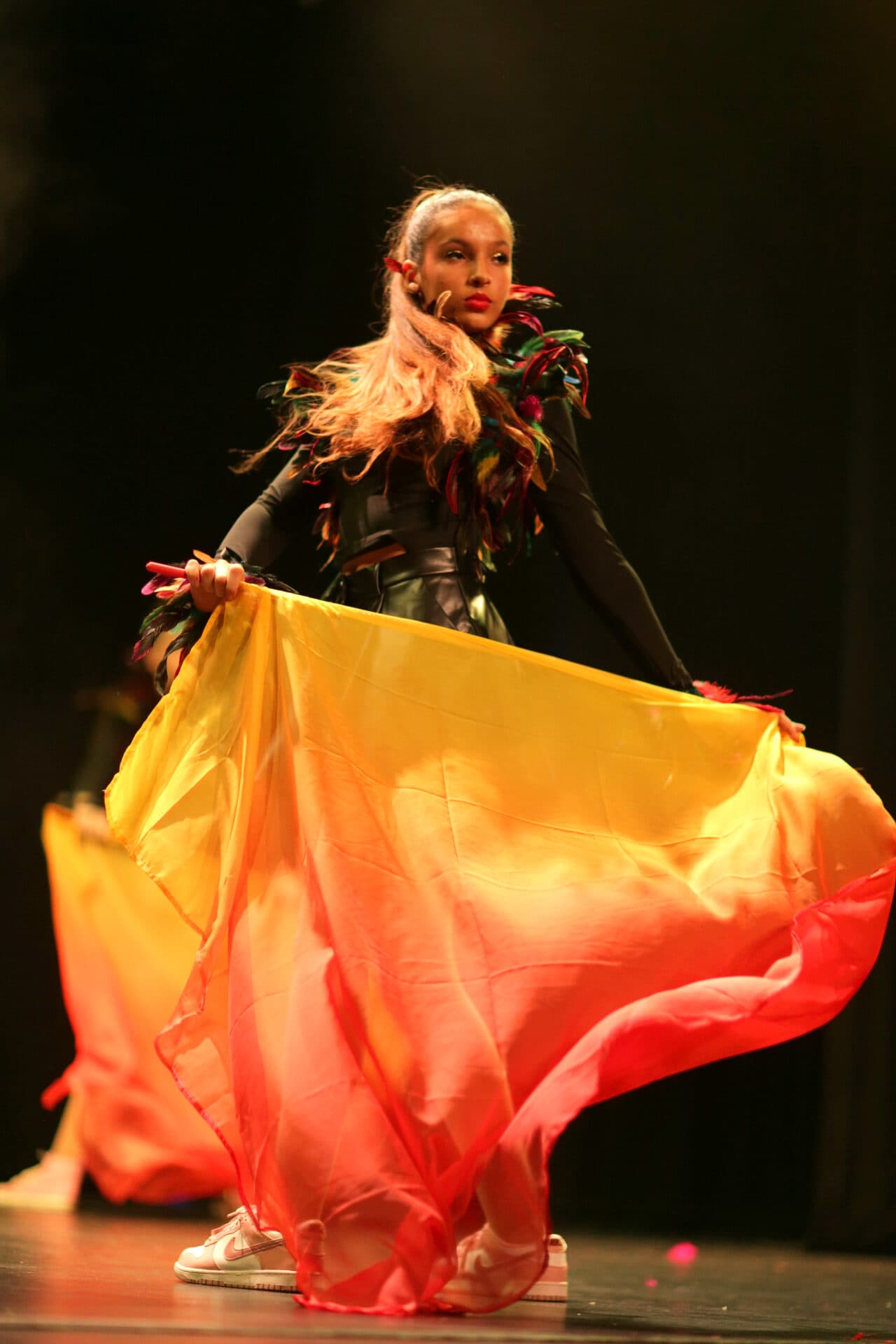 JA Performing Arts senior soloist swirling a silk in performance