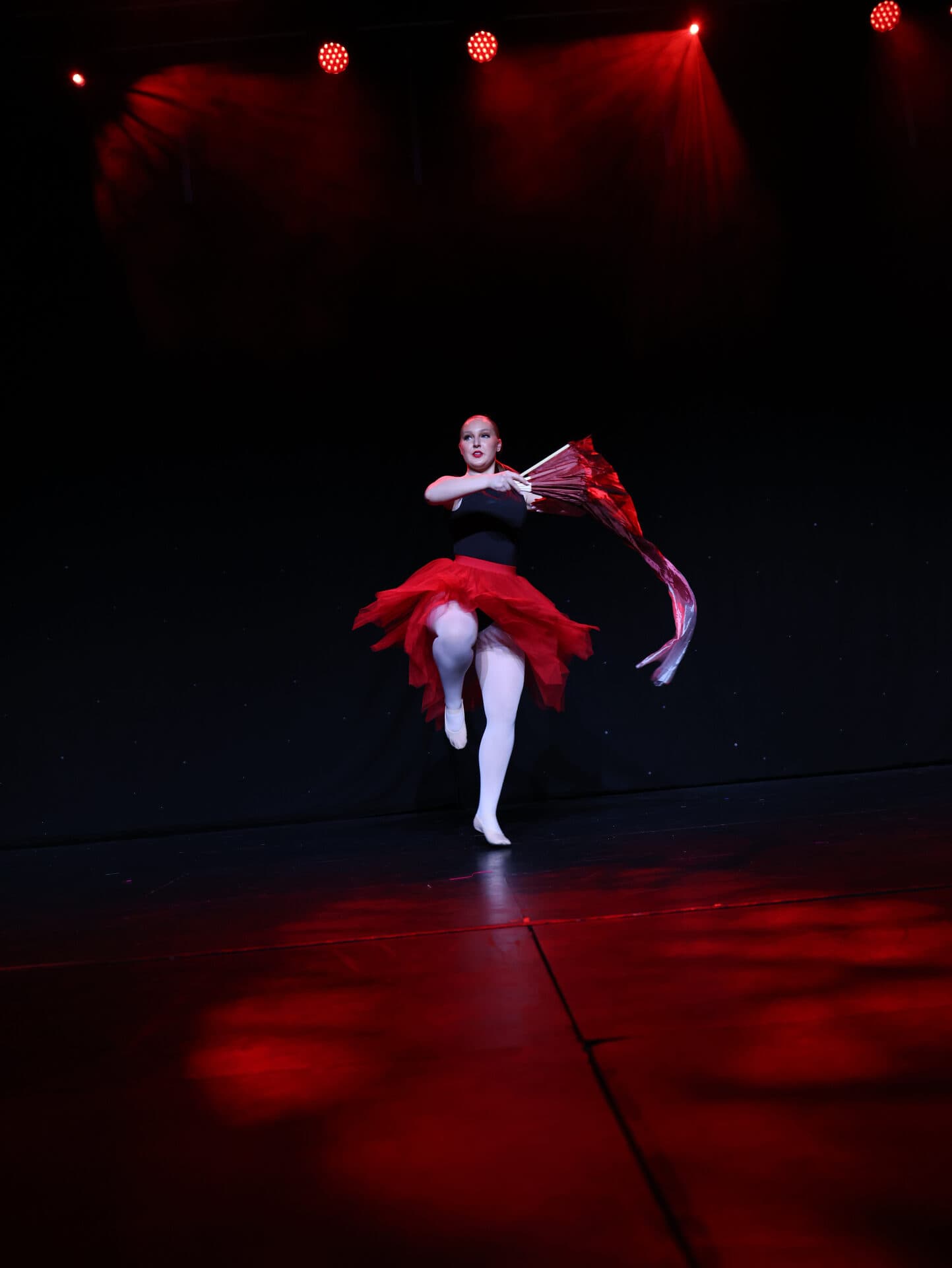 JA Performing Arts lyrical solo en pointe with red fan