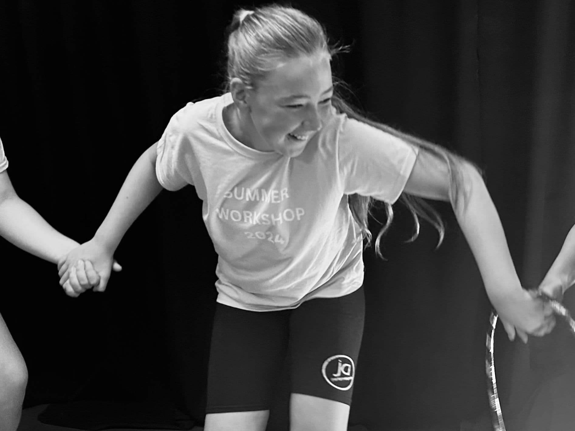 Senior dancer mid-movement at a JA summer workshop